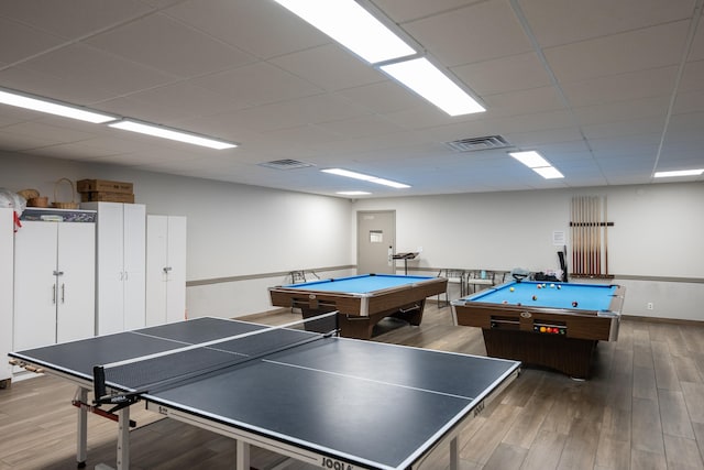 playroom with pool table, a drop ceiling, and hardwood / wood-style flooring