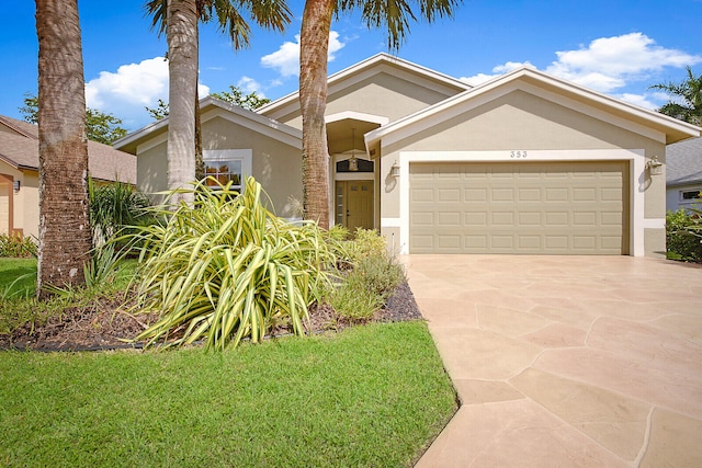 view of front of home with a front lawn and a garage