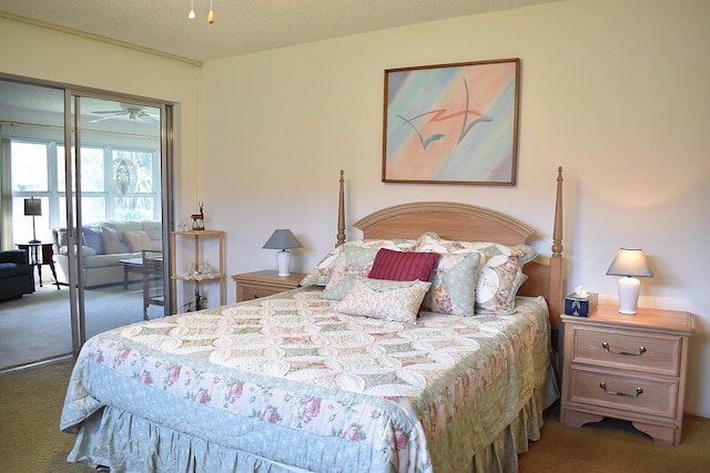 bedroom featuring carpet and a textured ceiling