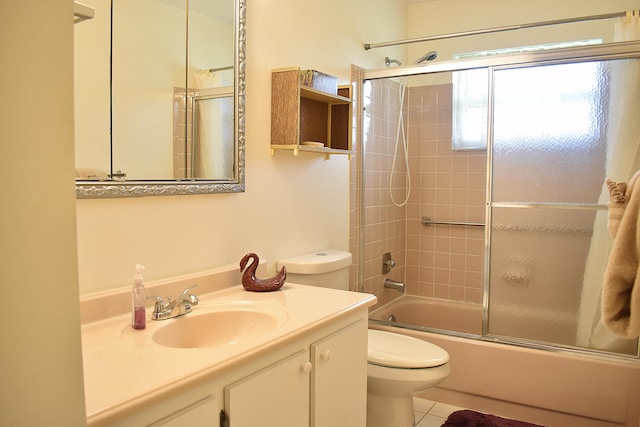 full bathroom with toilet, vanity, shower / bath combination with glass door, and tile patterned flooring