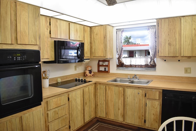 kitchen with sink and black appliances