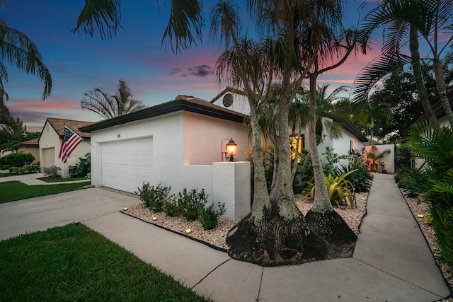 view of front of home with a garage