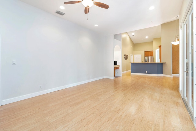 unfurnished living room with light hardwood / wood-style floors and ceiling fan