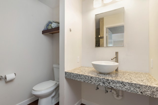 bathroom with sink and toilet