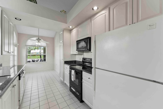 kitchen featuring white cabinetry, light tile patterned floors, black appliances, lofted ceiling, and ceiling fan