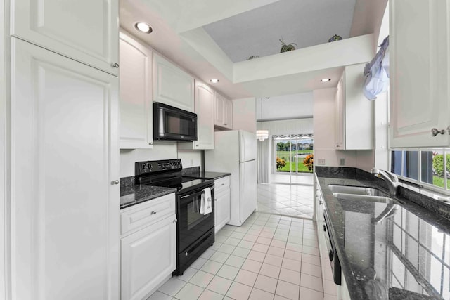 kitchen featuring sink, white cabinets, black appliances, decorative light fixtures, and dark stone countertops