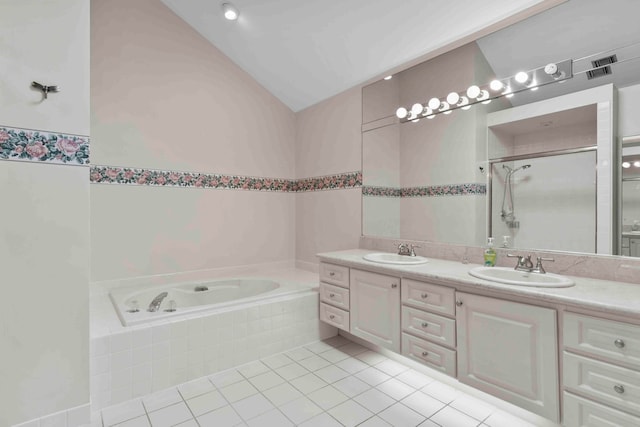 bathroom with tile patterned floors, independent shower and bath, vanity, and vaulted ceiling