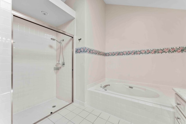 bathroom with tile patterned flooring, vanity, and separate shower and tub