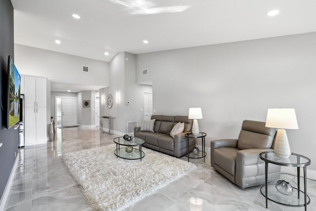 living room with a high ceiling