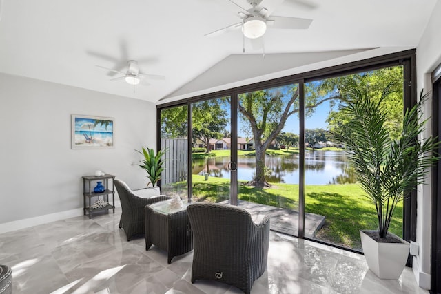 interior space with a water view, ceiling fan, and plenty of natural light