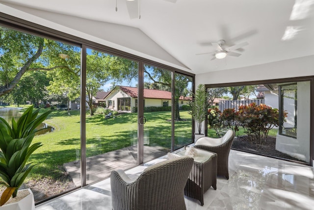 sunroom with lofted ceiling and ceiling fan