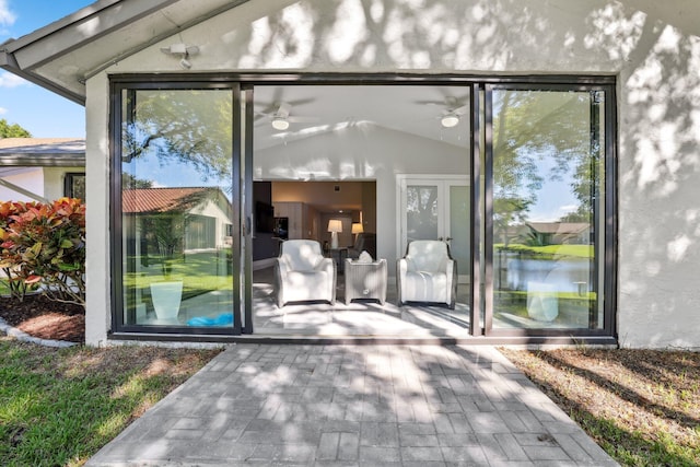 entrance to property with ceiling fan