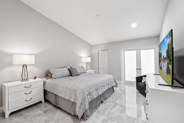 bedroom featuring vaulted ceiling and a closet