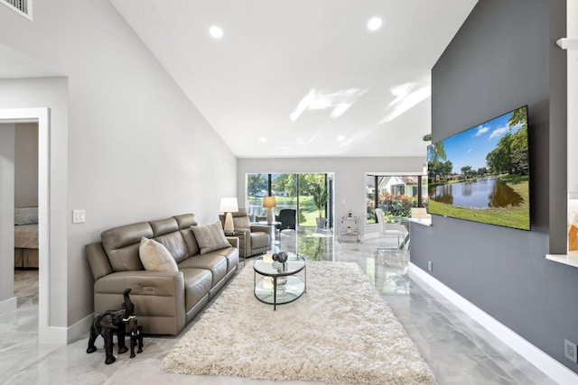 living room featuring vaulted ceiling