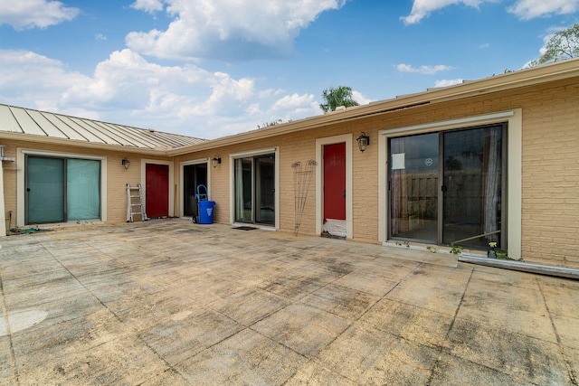 rear view of property with a patio area