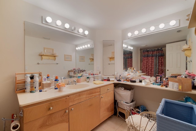 bathroom with vanity and tile patterned floors