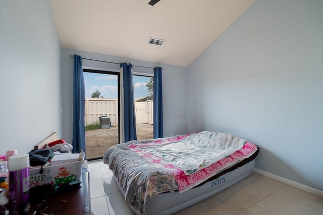 tiled bedroom featuring ceiling fan and vaulted ceiling