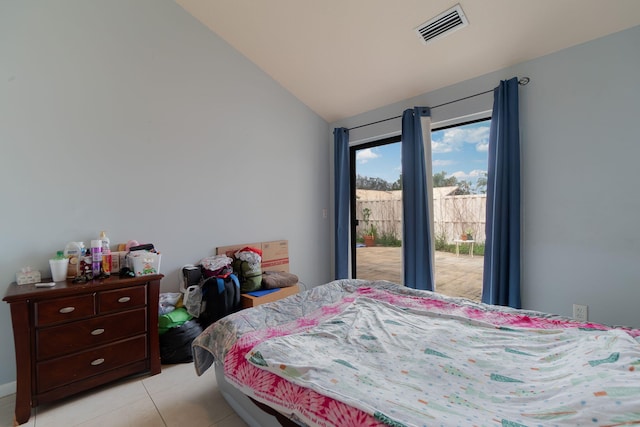 tiled bedroom with access to outside and vaulted ceiling