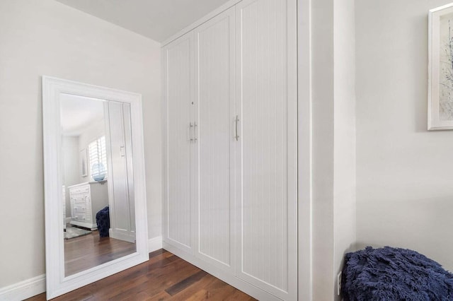 hall with dark hardwood / wood-style flooring