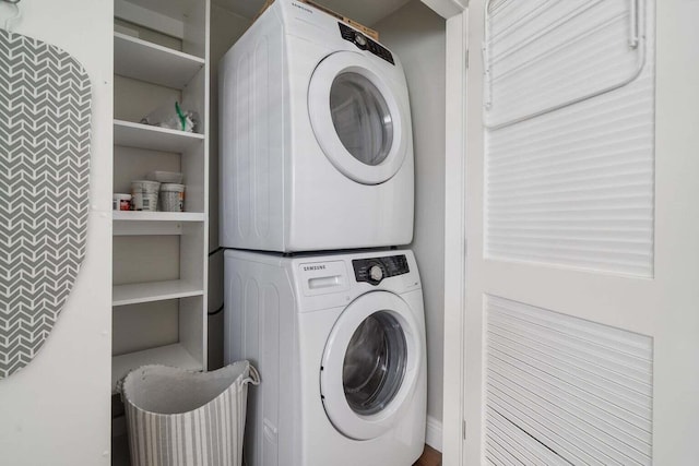 laundry room with stacked washer and dryer