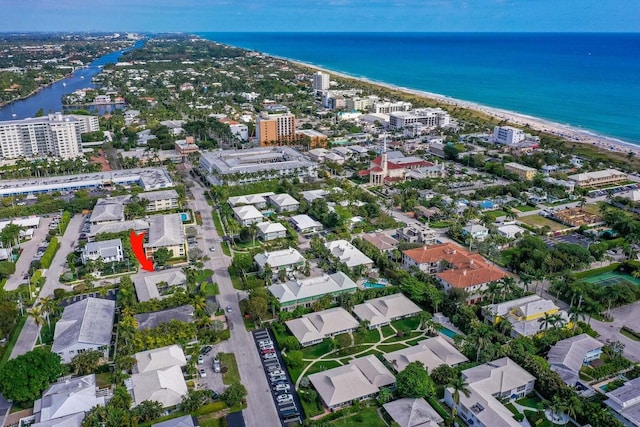 birds eye view of property featuring a water view and a view of the beach