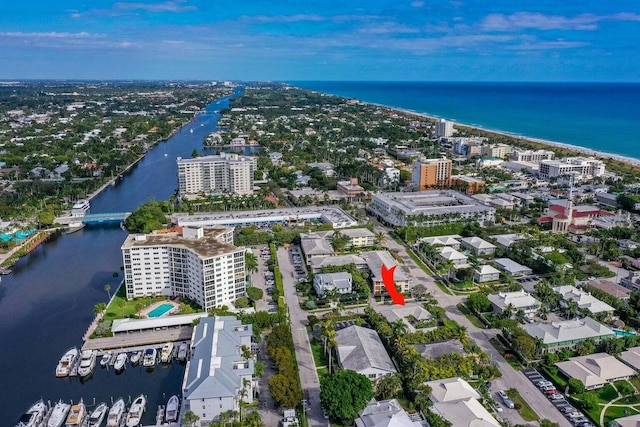 birds eye view of property with a water view