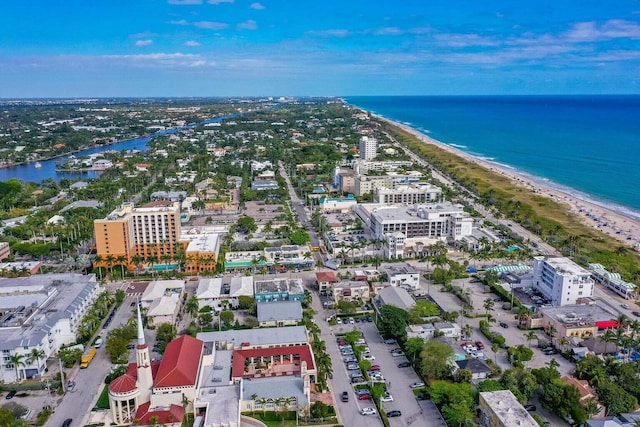 aerial view with a water view and a view of the beach