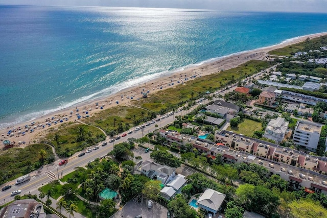 bird's eye view featuring a water view and a view of the beach