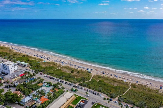 aerial view featuring a water view and a view of the beach