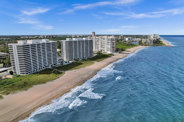 birds eye view of property featuring a view of the beach and a water view