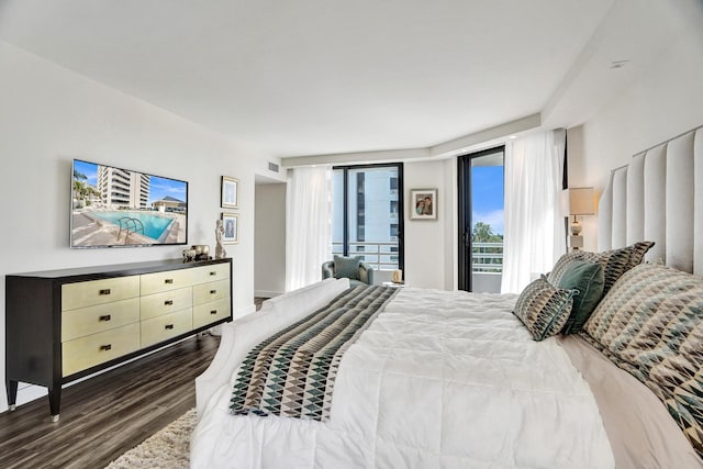 bedroom featuring dark hardwood / wood-style flooring