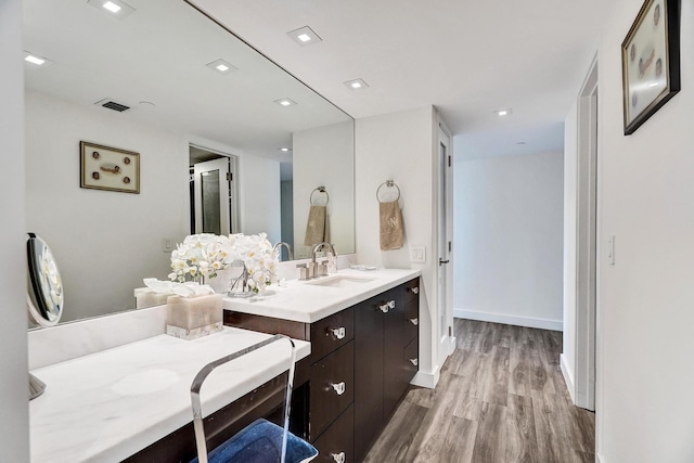 bathroom featuring hardwood / wood-style floors and vanity