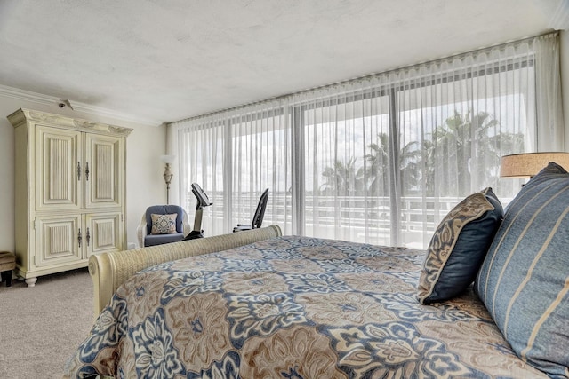 carpeted bedroom with a textured ceiling and crown molding