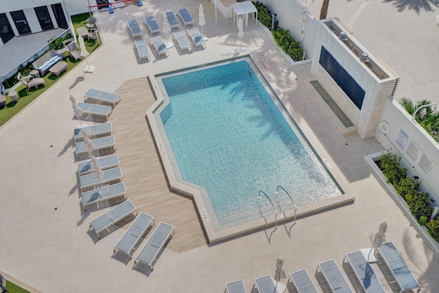 view of swimming pool with a patio area