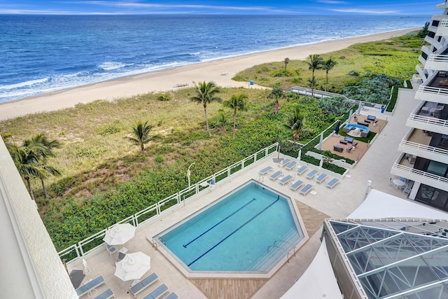 exterior space featuring a view of the beach and a water view