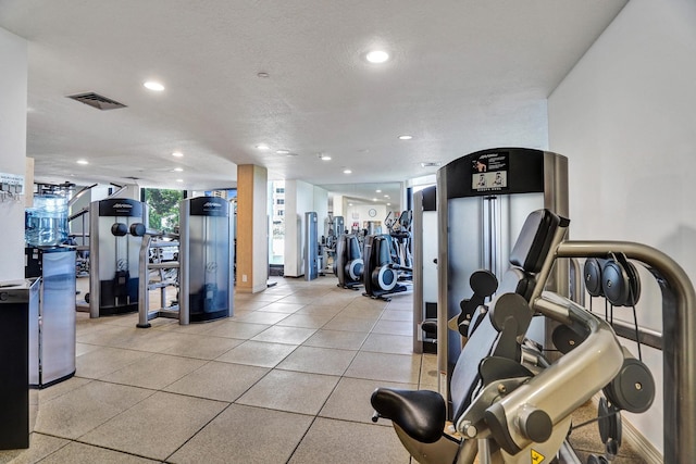 gym with a textured ceiling