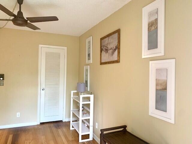 interior space with ceiling fan and hardwood / wood-style floors