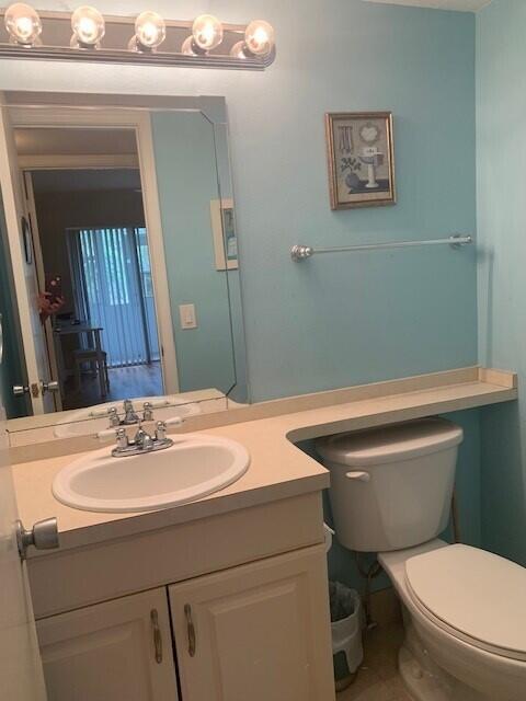 bathroom with vanity and toilet