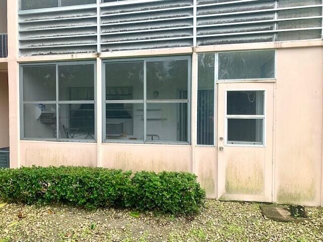 view of side of property with a sunroom