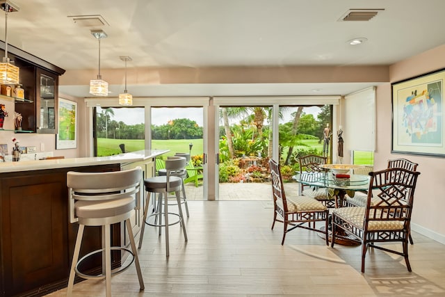 dining area with light wood-type flooring