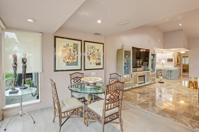 dining area with vaulted ceiling