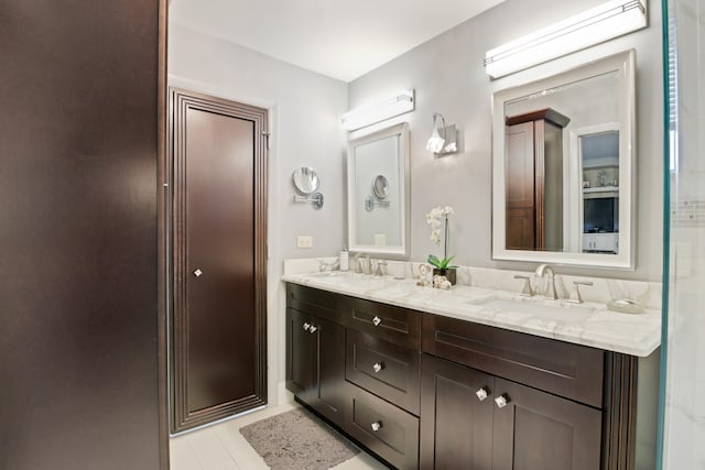 bathroom featuring vanity and an enclosed shower