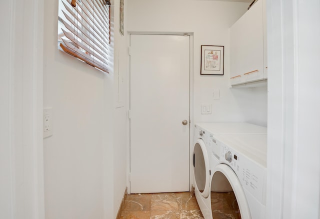 laundry area featuring cabinets and washing machine and dryer