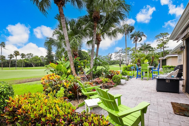 exterior space with a patio area and a lawn