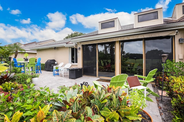 back of property with a patio area