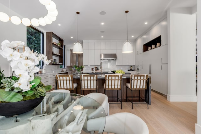 interior space featuring sink and light hardwood / wood-style flooring