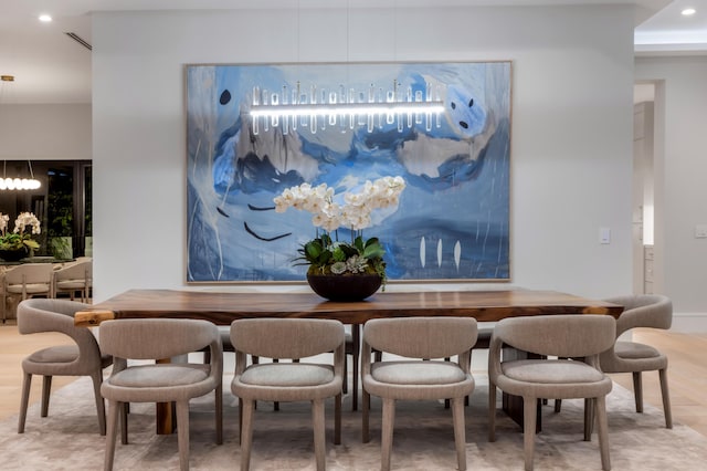 dining space featuring hardwood / wood-style floors