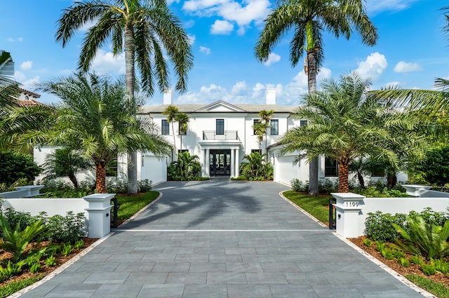 back of property featuring a patio and a balcony