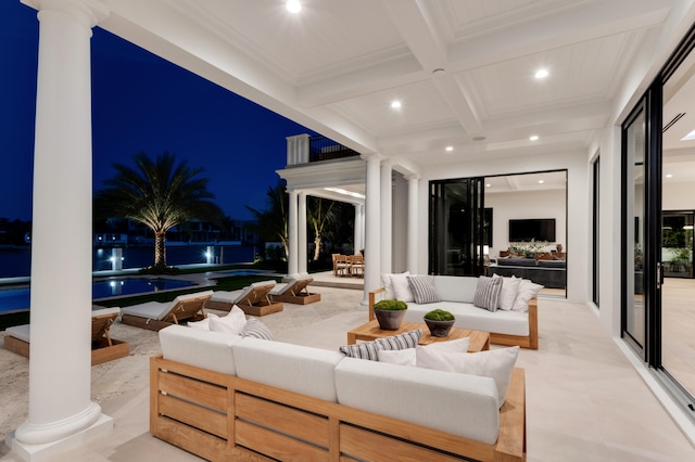 view of patio / terrace featuring a water view and outdoor lounge area