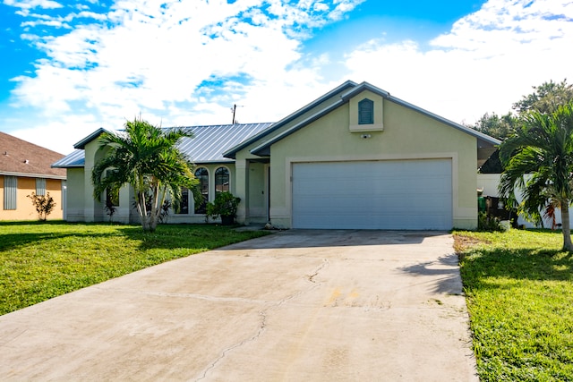 single story home featuring a garage and a front yard